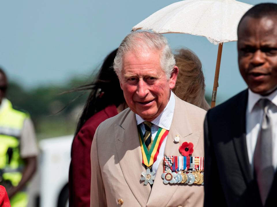 Britain's Prince Charles (C), the Prince of Wales attends the welcome ceremony at the Jubilee House in Accra on November 2, 2018.