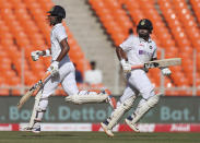 India's Rishabh Pant, right, and Washington Sundar run between the wickets to score during the second day of fourth cricket test match between India and England at Narendra Modi Stadium in Ahmedabad, India, Friday, March 5, 2021. (AP Photo/Aijaz Rahi)