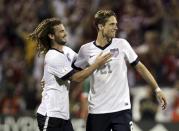 United States players Kyle Beckerman (L) and Clarence Goodson celebrate their victory over Mexico in their 2014 World Cup qualifying soccer match in Columbus, Ohio September 10, 2013. REUTERS/Matt Sullivan