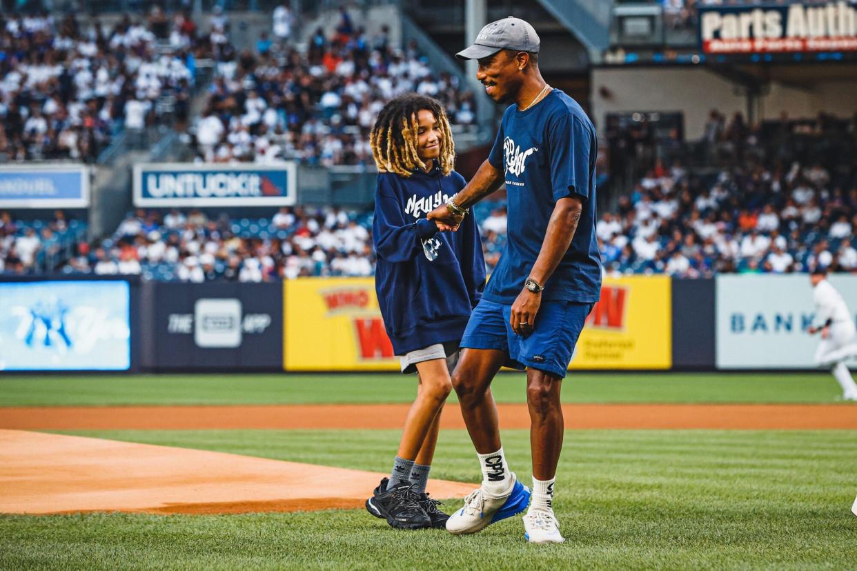 Pharrell Williams and Rocket Ayer Williams- first pitch at Yankee Stadium