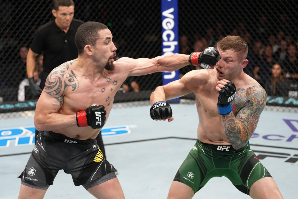 PARIS, FRANCE - SEPTEMBER 03: (L-R) Robert Whittaker of New Zealand punches Marvin Vettori of Italy in a middleweight fight during the UFC Fight Night event at The Accor Arena on September 03, 2022 in Paris, France. (Photo by Jeff Bottari/Zuffa LLC)