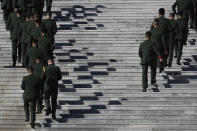 Chinese paramilitary policemen arrive to the Great Hall of the People to attend the commemorating conference on the 70th anniversary of China's entry into the 1950-53 Korean War, in Beijing Friday, Oct. 23, 2020. (AP Photo/Andy Wong)