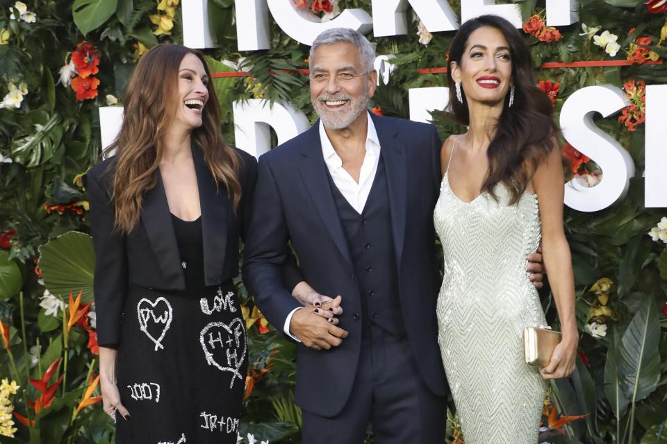 Julia Roberts and George Clooney and his wife Amal Clooney pose for the media at the world premiere of the movie 'Ticket To Paradise' at the Odeon Luxe theater in Leicester Square in London, Britain, 07 September 2022