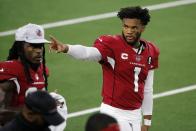 Arizona Cardinals' Kyler Murray (1) waves to fans in the stands in the first half of an NFL football game against the Dallas Cowboys in Arlington, Texas, Monday, Oct. 19, 2020. (AP Photo/Michael Ainsworth)