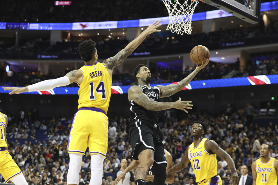 Brooklyn Nets' Wilson Chandler goes to the basket against Los Angeles Lakers' Danny Green, left, during a preseason NBA game in Shanghai, China, Thursday, Oct. 10, 2019. (AP Photo)