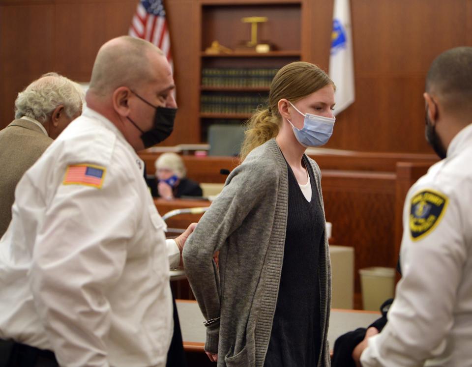 Julia Enright is escorted from the courtroom after her second-degree murder conviction Monday in Worcester Superior Court.