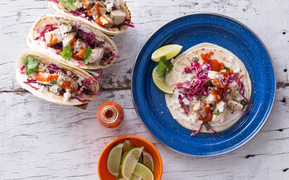 <p>Mark Boughton</p><p>With a little advance prep, these grilled tequila lime fish tacos are an easy tailgating dish.</p><p><strong>Get the recipe: <a href="https://parade.com/685128/guyfieri/grilled-tequila-lime-fish-tacos-with-cilantro-lime-crema/" rel="nofollow noopener" target="_blank" data-ylk="slk:Grilled Tequila Lime Fish Tacos with Cilantro Lime Crema;elm:context_link;itc:0;sec:content-canvas" class="link ">Grilled Tequila Lime Fish Tacos with Cilantro Lime Crema</a></strong></p>