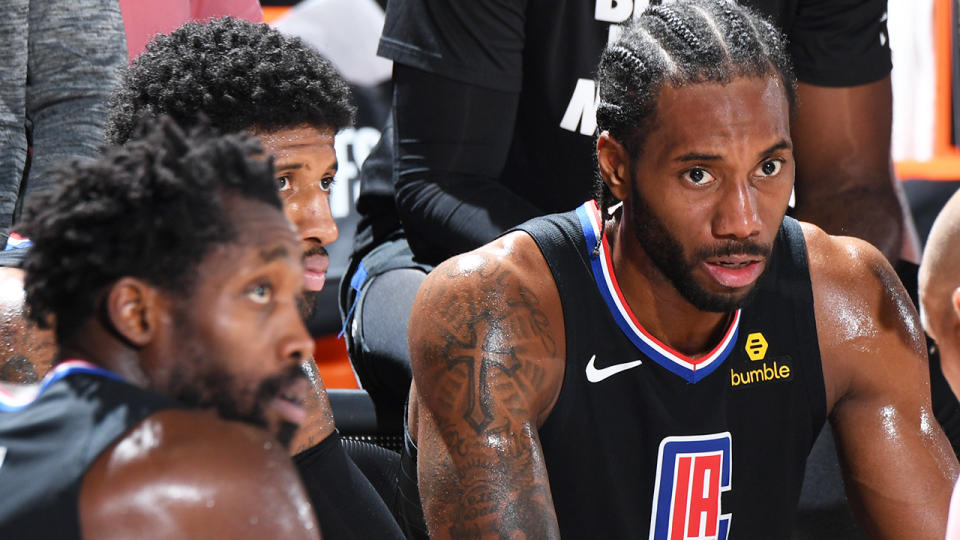 Kawhi Leonard is pictured looking on during a timeout.