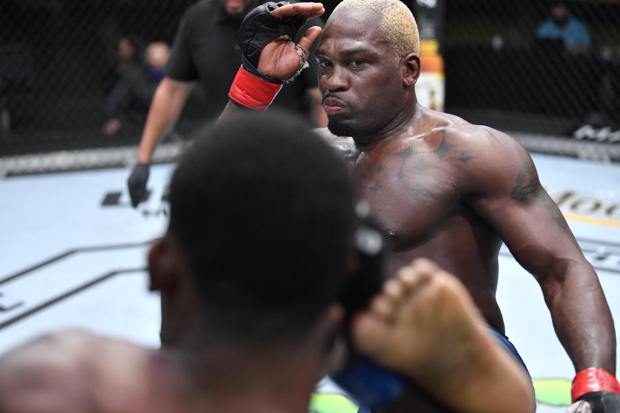 LAS VEGAS, NEVADA - MARCH 20: (R-L) Derek Brunson kicks Kevin Holland in their middleweight fight during the UFC Fight Night event at UFC APEX on March 20, 2021 in Las Vegas, Nevada. (Photo by Chris Unger/Zuffa LLC via Getty Images)