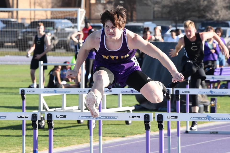 Wylie's Holden Atwood clears a hurdle in the 110-meter hurdles during the ACU Wildcat Relays last year at Elmer Gray Stadium.