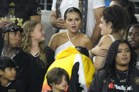 Entertainer Selena Gomez, center, is seen along with rapper Tyga, left, during the second half of a Major League Soccer match between Los Angeles FC and Inter Miami Sunday, Sept. 3, 2023, in Los Angeles. (AP Photo/Mark J. Terrill)