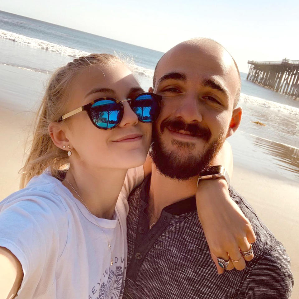 Laundrie and Petito pose on a beach. (gabspetito / Instagram)