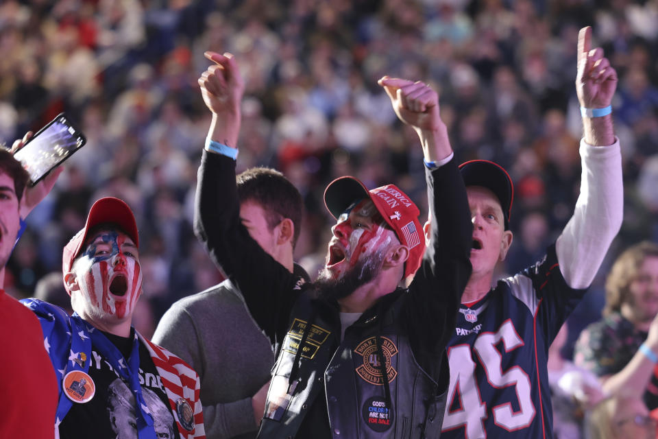 CAPTION CORRECTION CORRECTS DATE: Attendees cheer during a campaign rally for former president Donald Trump, Saturday, Dec. 16, 2023, in Durham, N.H. (AP Photo/Reba Saldanha)