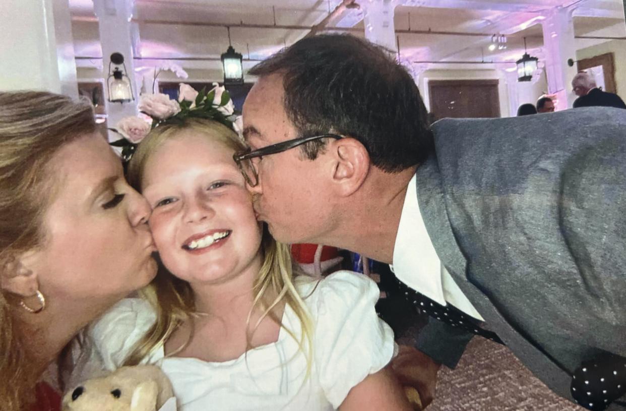 From left to right, Lindsay Gotwald, Annie Gotwald and Greg Gotwald are pictured at a family wedding.