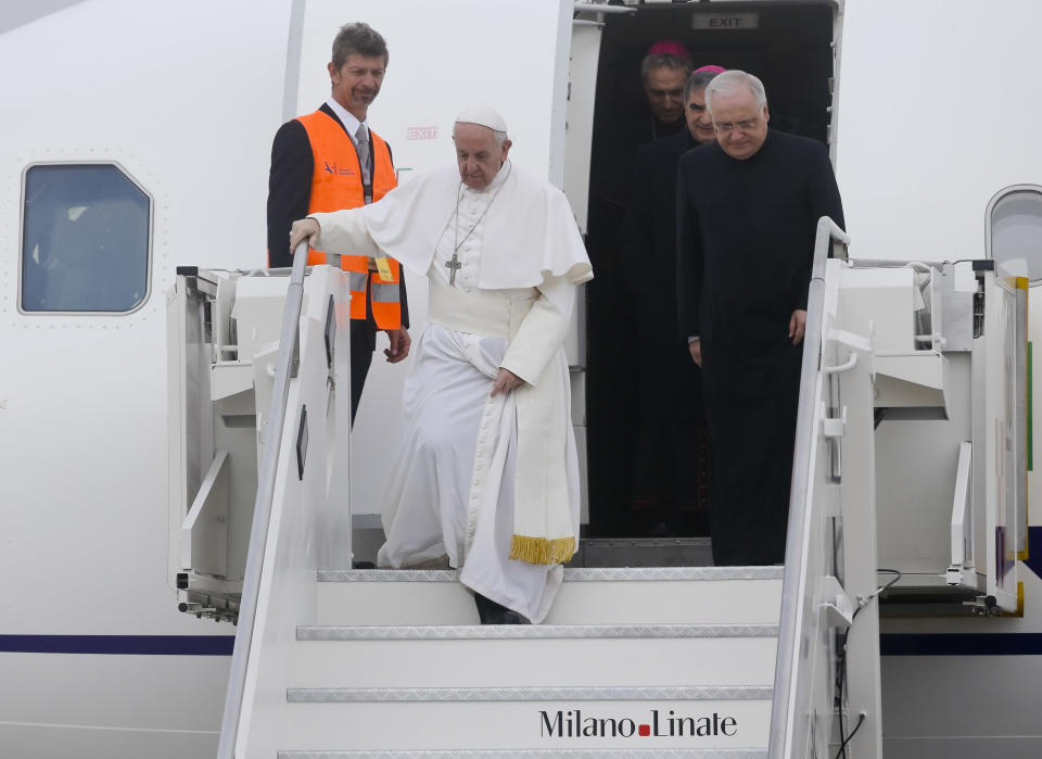 Pope Francis arrives at Linate airport, northern Italy, for a one-day pastoral visit to Monza and Milan, Italy’s second-largest city, Saturday, March 25, 2017. On Friday Francis welcomed 27 EU leaders to the Vatican on the eve of a summit to mark the 60th anniversary of the Treaty of Rome, the founding charter of the bloc. (AP Photo/Luca Bruno)