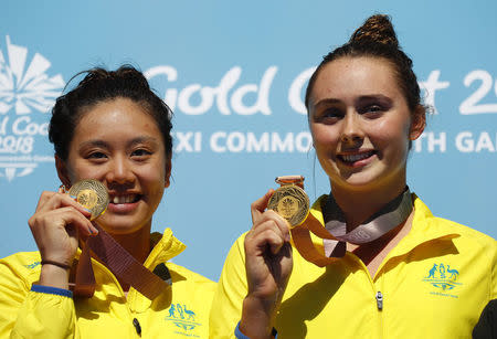 Diving - Gold Coast 2018 Commonwealth Games - Women’s Synchronised 3m Springboard - Victory Ceremony - Optus Aquatic Centre - Gold Coast, Australia - April 11, 2018. Esther Qin and Georgia Sheehan of Australia pose with their gold medals. REUTERS/David Gray