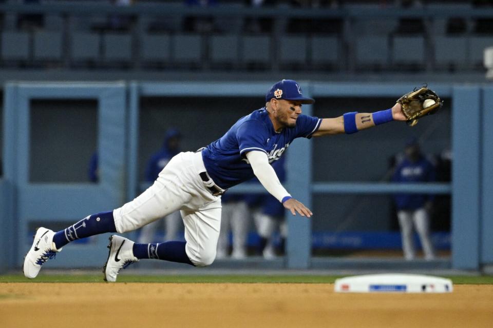 Dodgers shortstop Miguel Rojas makes a catch on a ball hit by the Angels' Luis Rengifo.