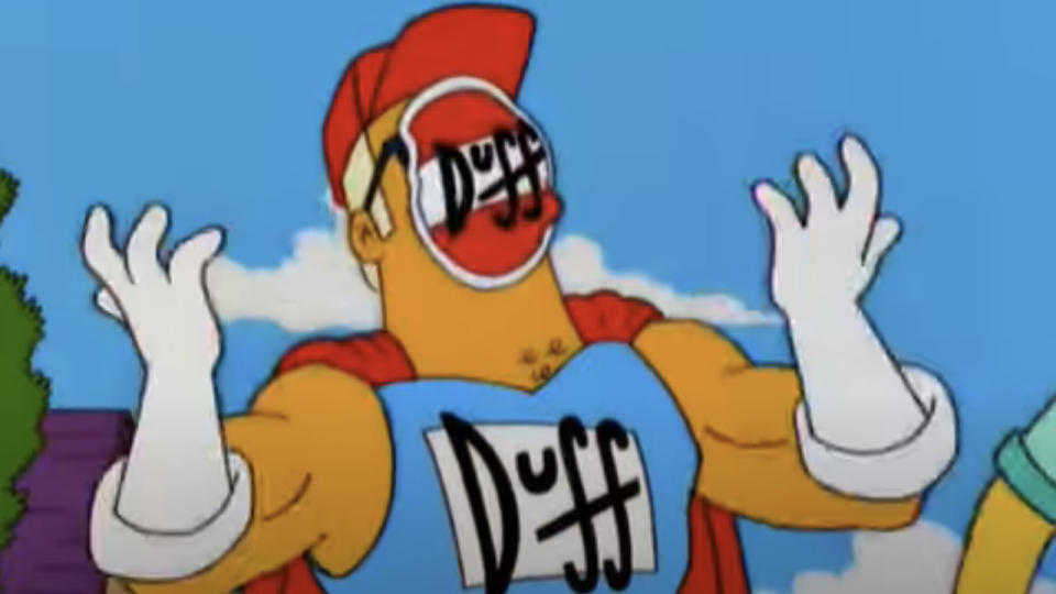 Duffman can't breathe with Duff sticker over his mouth in The Simpsons