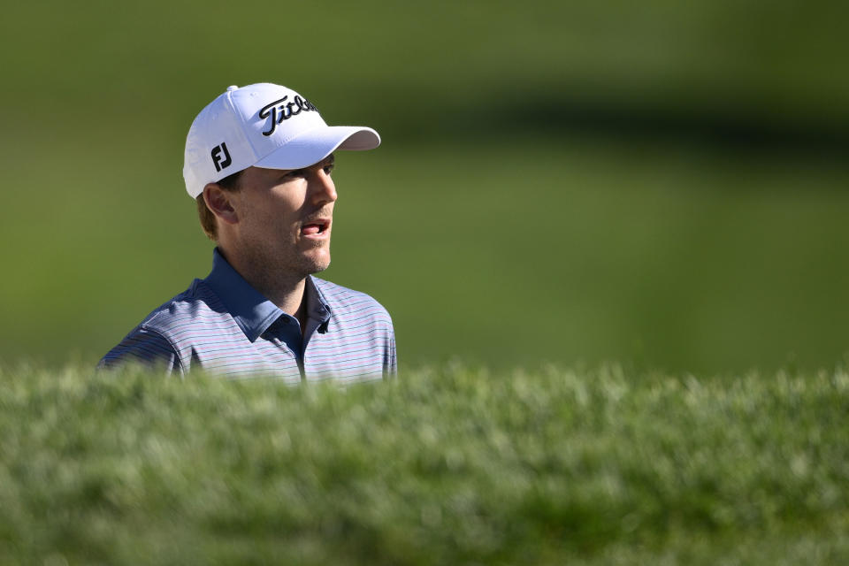 Russell Henley looks out of the bunker not eh 18th green during the first round of the BMW Championship golf tournament at Wilmington Country Club, Thursday, Aug. 18, 2022, in Wilmington, Del. (AP Photo/Nick Wass)