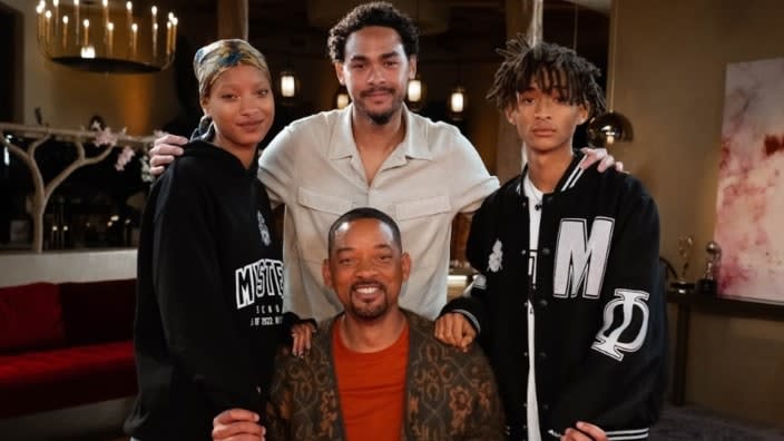 The latest episode of “Red Table Talk” is a Will Smith “takeover” episode, on which the Oscar-winning actor sits down at the Red Table with his three children, (Standing, from left) Willow, Trey and Jaden. (Photo: Jordan Fisher)
