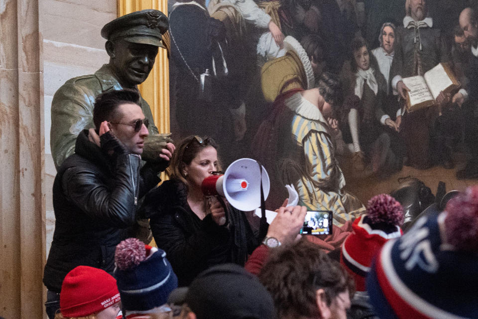 Supporters of US President Donald Trump protest in the US Capitol Rotunda on January 6, 2021, in Washington, DC. - Demonstrators breeched security and entered the Capitol as Congress debated the a 2020 presidential election Electoral Vote Certification. (Photo by SAUL LOEB / AFP) (Photo by SAUL LOEB/AFP via Getty Images)