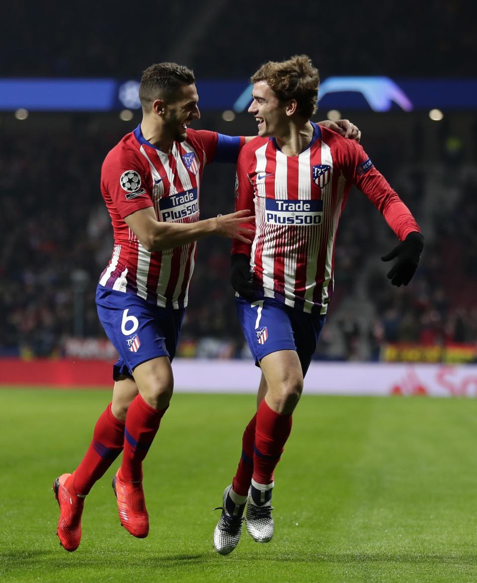 Atletico midfielder Koke, left, and his teammate Antoine Griezmann celebrate the opening goal of their team during a Group A Champions League soccer match between Atletico Madrid and Monaco at the Metropolitano stadium in Madrid, Wednesday, Nov. 28, 2018. (AP Photo/Manu Fernandez)