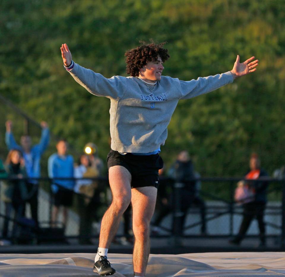 Saint Joseph senior Brady Farrell celebrates after setting a new school record in the pole vault, reaching 14-03 feet at the South Bend city track and field meet Thursday, April 25, 2024, at Saint Joseph High School.