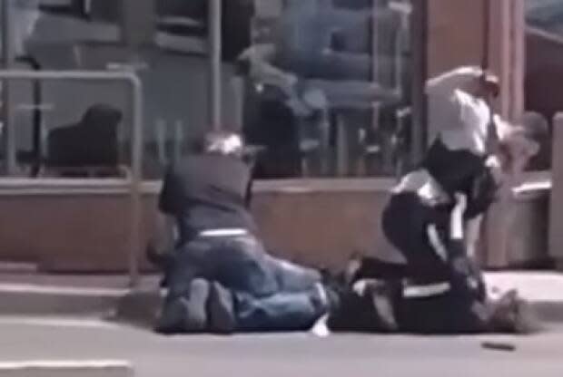 An RCMP officer was filmed repeatedly punching a man during an arrest in Campbellton, N.B. on Friday, July 2. (Facebook - image credit)