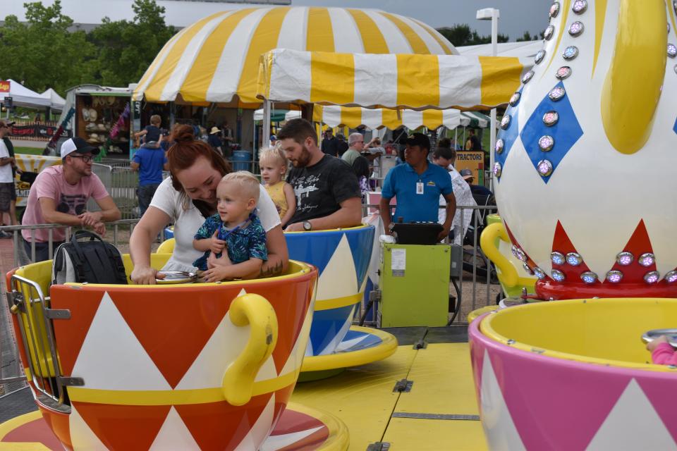 Families enjoy rides at the Larimer County Fair and Rodeo's Carnival Americana in 2021.