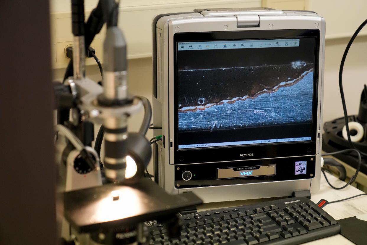 A cross section of a lead water pipe is displayed under a microscope in a lab at the U.S. Environmental Protection Agency’s Andrew W. Breidenbach Environmental Research Center in Cincinnati last February.