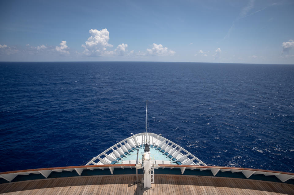 A close-up of a cruise ship's bow on the open sea.