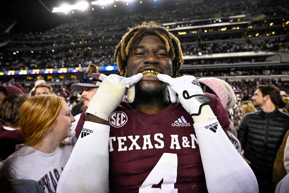 Texas A&M defensive lineman Shemar Stewart shows off his gold grill smile after the Aggies' win over LSU at Kyle Field last November. Everyone's looking forward to the Texas-Texas A&M rivalry resuming in 2024, but will the Longhorns and Aggies necessarily play each other every year as SEC schools?