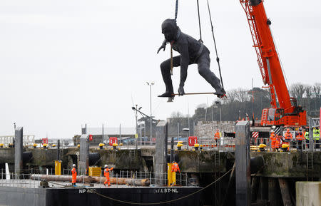 Britain's largest bronze sculpture, "Messenger" arrives by barge in Plymouth Sound before being taken by road to the Theatre Royal in Plymouth, Britain, March 18, 2019. REUTERS/Peter Nicholls