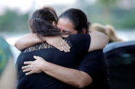 Cristina (R), one of the sisters of Gustavo Encina, Paraguayan pilot of the crashed plane that carried the Brazilian team Chapecoense, is seen before the arrival of her brother's remains at the Silvio Pettirossi International Airport in Luque, Paraguay December 2, 2016. REUTERS/Jorge Adorno