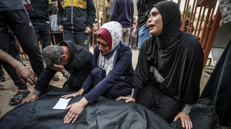 PHOTO: Relatives mourn over the body of a loved one killed during Israeli bombardment at Nasser Hospital in Khan Yunis on the southern Gaza Strip on Dec. 27, 2023. (AFP via Getty Images)