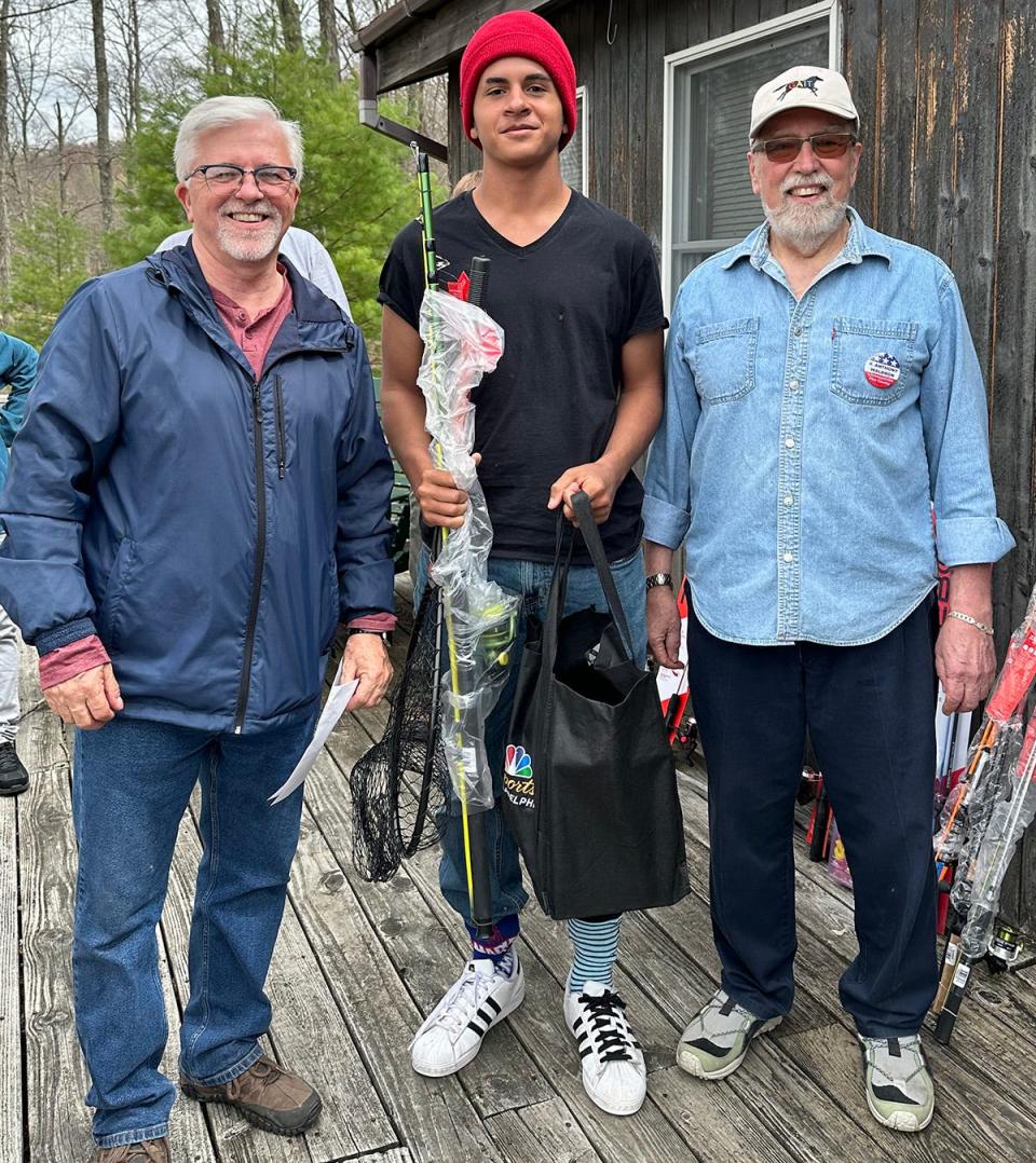 Pike County Commissioners hosted their 25th Annual Fishing Derby on Saturday, April 15 at Lily Pond near Milford. More than 200 young anglers participated. Pictured here is overall contest winner Gage Salazar (center) accepting his prizes from Commissioners Matthew Osterberg (left) and Tony Waldron (right).