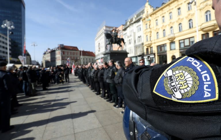 A police officer stands by as supporters of a Croatian far-right party gather in Ban Jelacic Square in downtown Zagreb on February 26, 2017