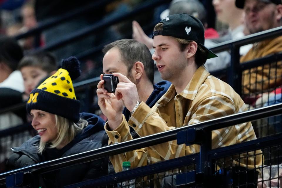 Feb 2, 2024; Columbus, Ohio, USA; Columbus Blue Jackets forward Adam Fantilli cheers on his brother, Michigan defenseman Luca Fantilli and his former Wolverine teammates, during the NCAA men’s hockey game against the Ohio State Buckeyes at Value City Arena.