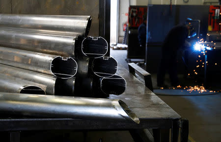 A worker is seen welding the aluminium parts of goals at Interplastic, a Polish manufacturing company who are supplying the football goalposts for the 2018 World Cup finals in Russia, in Chwaszczyno, Poland, May 16, 2018. Picture taken May 16, 2018. REUTERS/Kacper Pempel