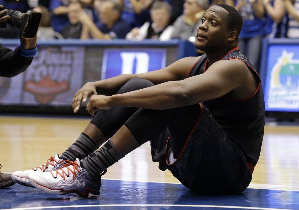 Maryland's Charles Mitchell sits on the court following Duke's 69-67 win over Maryland in an NCAA college basketball game in Durham, N.C., Saturday, Feb. 15, 2014. Duke won 69-67. (AP Photo/Gerry Broome)