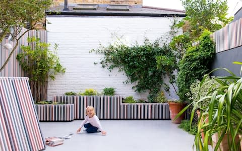  Isabella, four, playing in the garden - Credit:  Ruth Ward