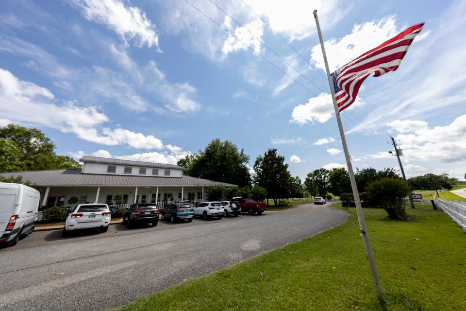 The Us Flag flies at half mast Sunday, June 20, 2021, in Camp Hill, Ala.,  at the Alabama Sheriff's Girls Ranch which suffered a loss of life when their van was involved in a multiple vehicle accident Saturday, resulting in eight people in the van perishing. (AP Photo/Vasha Hunt)