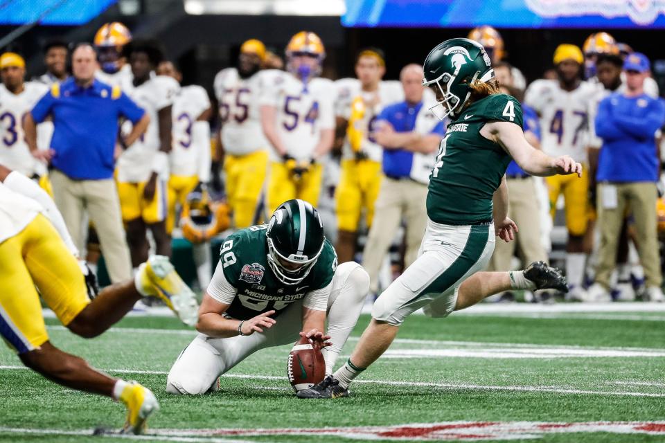 Michigan State place kicker Matt Coghlin (4) attempts a field goal against Pittsburgh during the first half of the Peach Bowl at the Mercedes-Benz Stadium in Atlanta, Ga. on Thursday, Dec. 30, 2021.