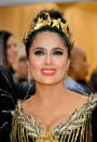 <p> This look seen on Salma Hayek on the Met Gala red carpet back in 2019 is both bold and glamorous. The star paired a bright and warm orange-toned red lipstick with a classic smokey eye and fluterry lashes for maximum impact. </p>