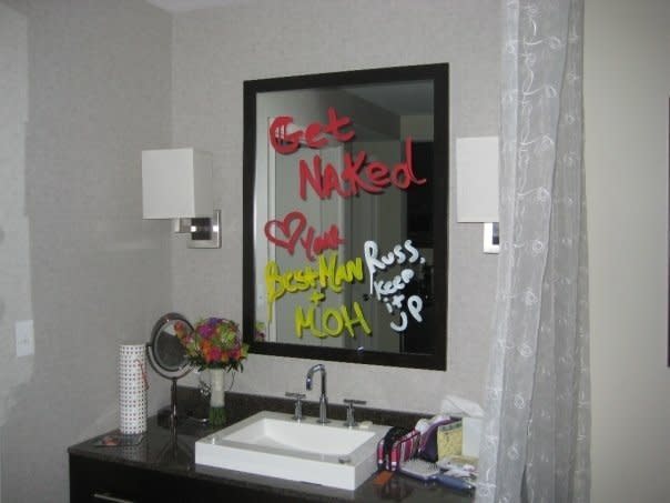 "After partying with friends and family until about 3:30 a.m., we finally made it back up to our room and found this on our mirror from the best man and maid of honor!" 