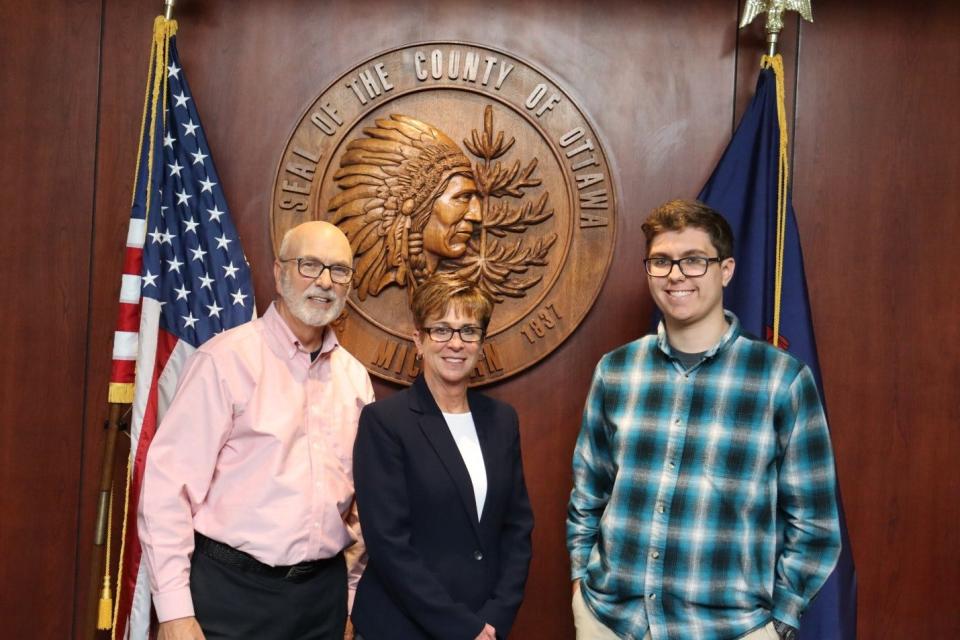 Ottawa County Commissioner Roger Bergman, former Ferrysburg Mayor Rebecca Hopp and Jenison student Aidan Palmbos.