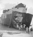 FILE - Natives of Bikini Atoll, scene of upcoming atomic tests, go ashore on the beach at Rongerik Atoll, their new home, after being moved in a Navy LST, on March 14, 1946. For decades, the tiny Marshall Islands has been a stalwart American ally. Its location in the middle of the Pacific Ocean has made it a key strategic outpost for the U.S. military. (AP Photo/Clarence Hamm, File)