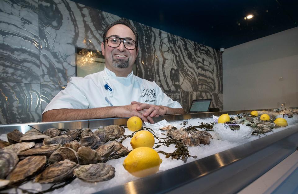 Owner George Lazi poses at the Oyster Bar in the Pearl Room at the new Pearl & Horn Restaurant on Barrancas Avenue in Pensacola on Wednesday, Dec. 20, 2023.