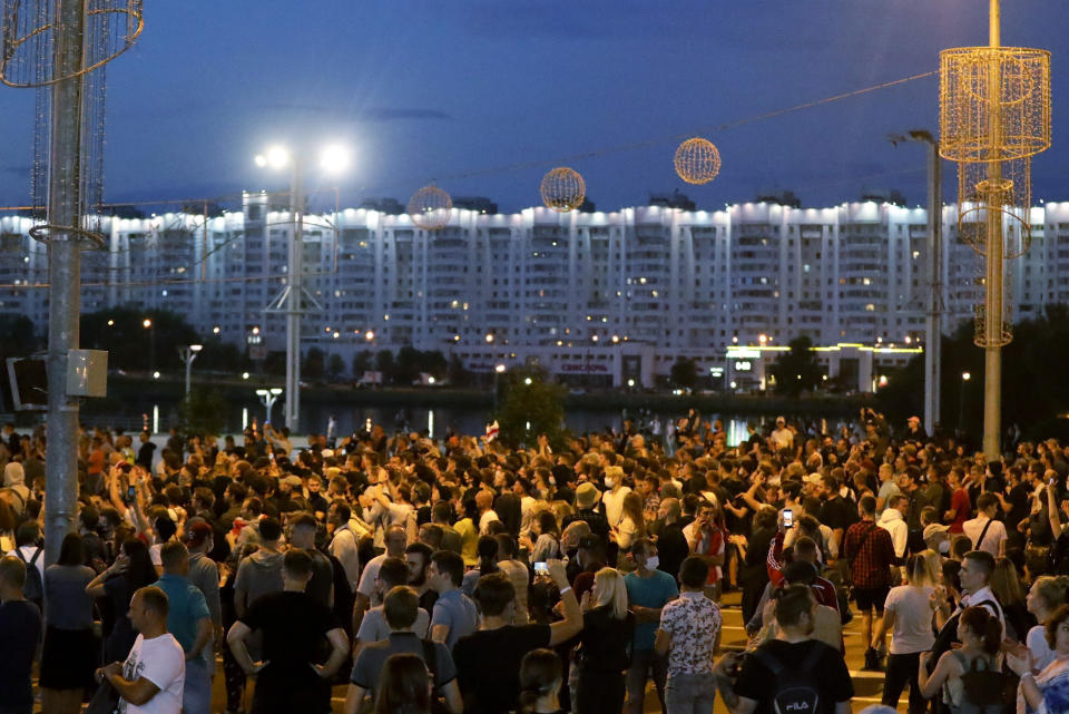 Police gather during a mass protest following presidential elections in Minsk, Belarus, Monday, Aug. 10, 2020. Thousands of people have protested in Belarus for a second straight night after official results from weekend elections gave an overwhelming victory to authoritarian President Alexander Lukashenko, extending his 26-year rule. A heavy police contingent blocked central squares and avenues, moving quickly to disperse protesters and detained dozens. (AP Photo/Sergei Grits)