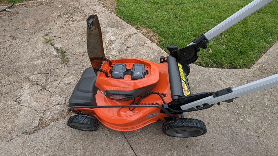 A close-up of the controls on the Husqvarna Lawn Xpert LE-322